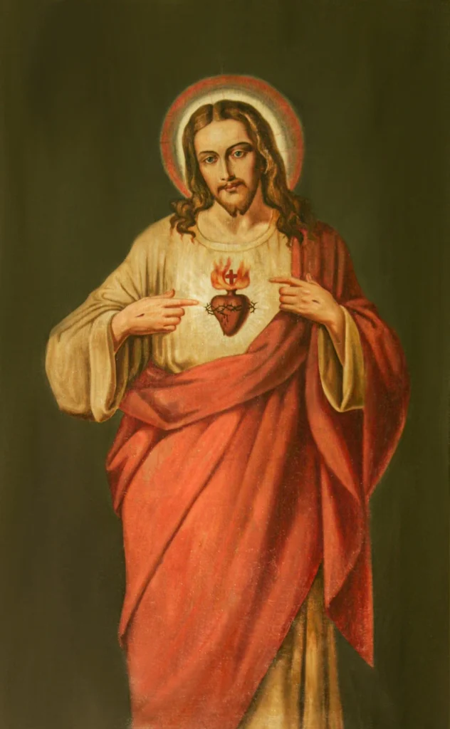 Jezus Chrystus wskazujący dłońmi na Najświętsze Serce.